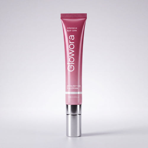 Roze PDRN Peptide Oog Crème tube met zilveren applicator op lichte achtergrond